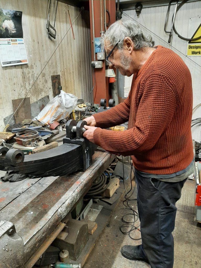 Keith checking a new bush on a spring